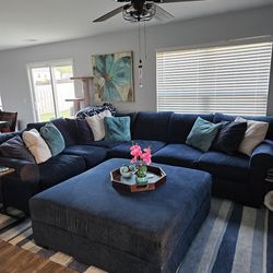 Beautiful Blue Sectional With Oversized Ottoman And Free Rug.