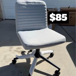 Brand New. Grey Armless Task Chair. Adjustable Height/Swivel. 