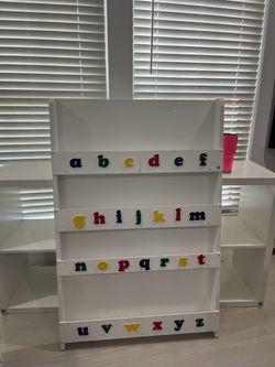 Tidy bookshelf with alphabet