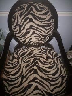 Zebra print and wooden chairs brand new $160 for both