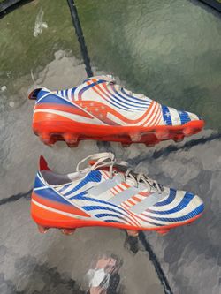 Adidas boys size 5 1/2 White, Orange and Blue Striped Cleats.