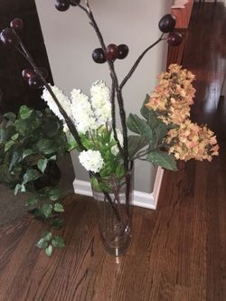 Flower arrangement in heavy long vase