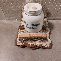 Vintage Mary Kay's Cookie Jar By Clay Arts
White base with cobalt blue writing and stripe.
