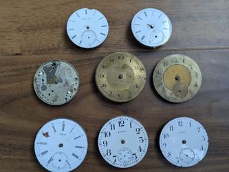Collection of old antique pocket watch dials and movements from 1800s to early 1900s.  Lot (B).  Likely missing parts, not working. Can be used for cr