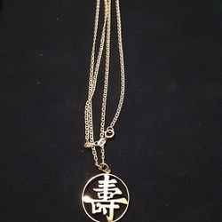 14K GOLD 24" CHAIN AND 14K GOLD ASIAN CHARM
