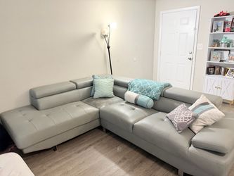 Gray Leather Sectional Sofa with Adjustable Headrests