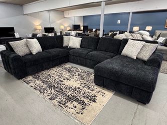 Large cloud sectional couch with pop out sleeper and storage chaise modular