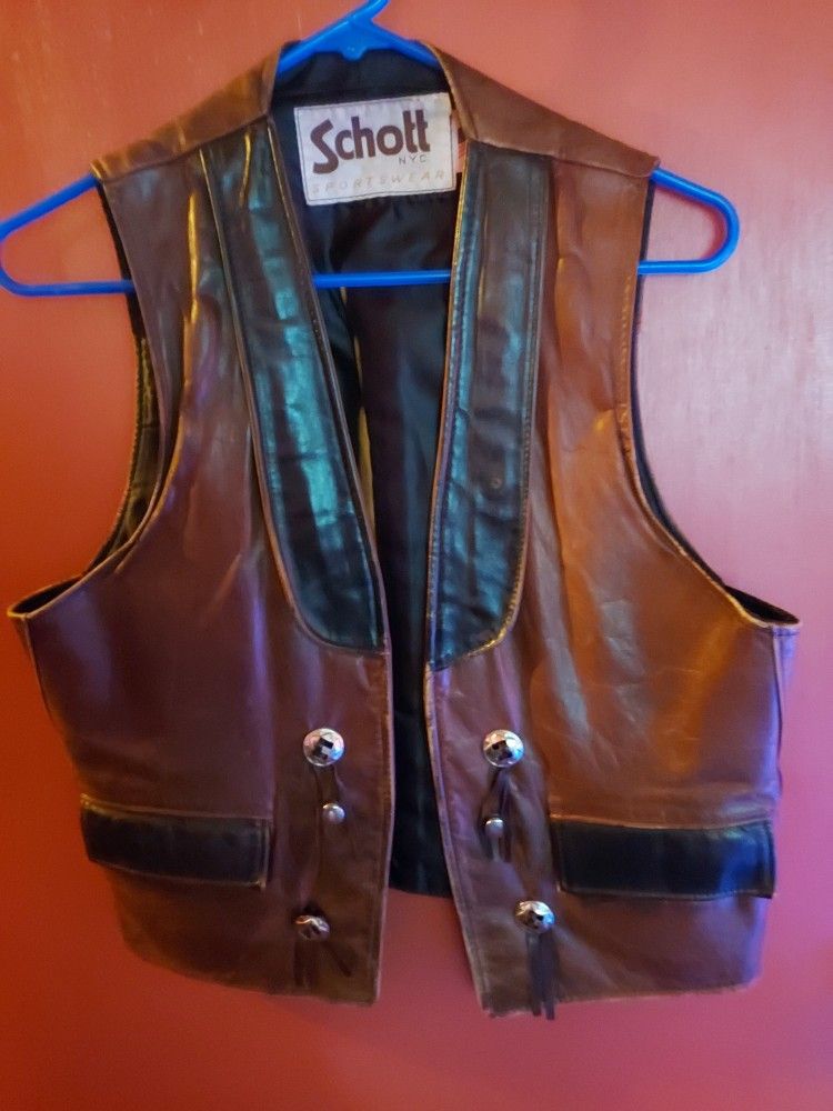 For Sale Brown and Black leather vest pretty neat Size Medium $100 OBO