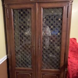 This Item Has Not Been Sold/ IlIt Is alarge beautiful solid wood china closet. Shelves, silver drawer and storage in the bottom. Excellent condition. 