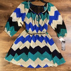Brand new Woman’s Sequin Hearts brand blue, teal, black, and white colored zig zag dress up for sale 