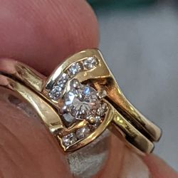 14K DIAMOND SET. TWO RINGS WELDED TOGETHER
