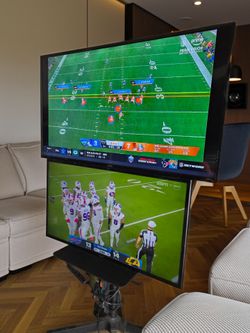 Two TVs with Rolling Floor Stand with Wheels