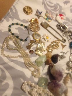 Beads , crystals , amethyst chunks , rose quarts And green and pink calcite . $40 obo