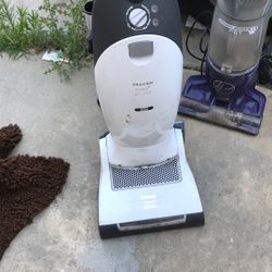 Various House Cleaning Vacuums And Carpet Cleaners 
