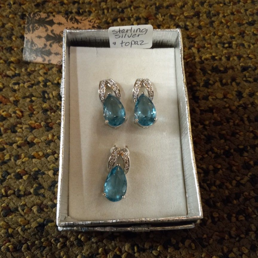 Sterling Silver And Blue Topaz Earrings And Pendant