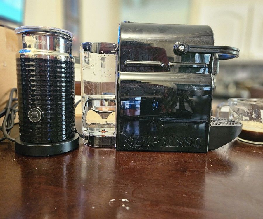 Compact espresso machine with Aeroccino milk frother.