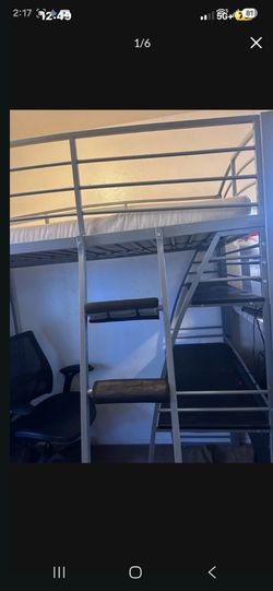 Bunk bed with shelves and desk