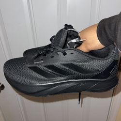 Duramo SL running shoes in core black. Adidas 