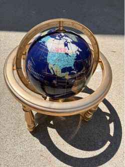 Unique Art blue lapis gemstone globe featuring a gold-toned tripod stand