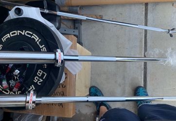 Brand new Olympic bars and Olympic weight plates.