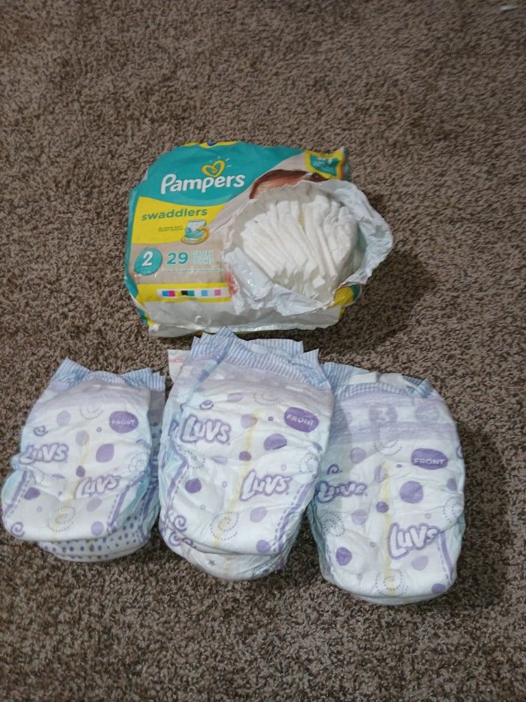 Luvs, Pampers Diapers. Size 2-3