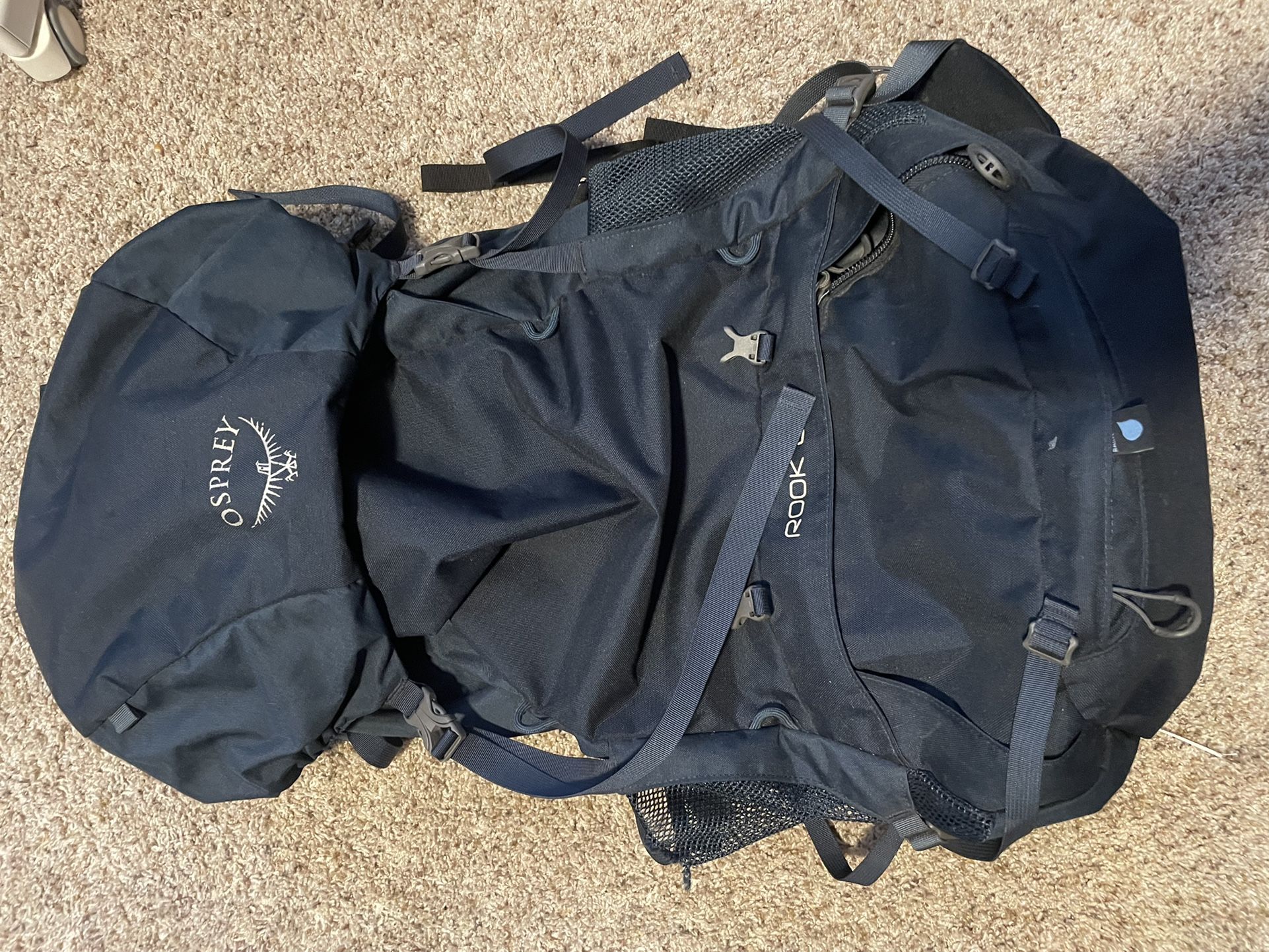 navy blue osprey rook 65 backpacking pack 