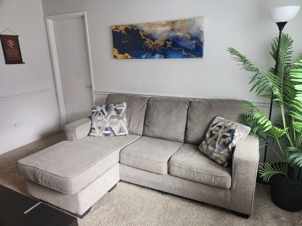 L-Shaped Couch With Pillows