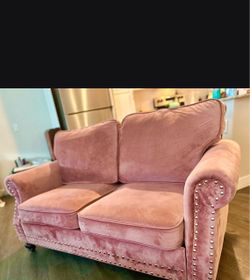 Rose colored loveseat