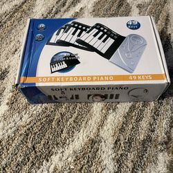 Soft Keyboard Piano - 49 Keys (Used Once) This portable, roll-up soft keyboard piano is in excellent, like-new condition, having only been used one ti