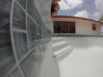 Pool glass tile, coping, and pool equipment.