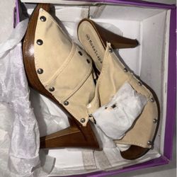 ModaScapa platform mules with a wooden heel