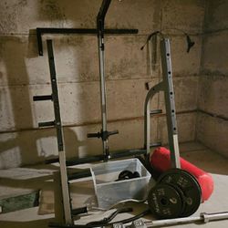 Nautilus Squat Rack With Bench , Weights, Dumbbells And Punching Bag 