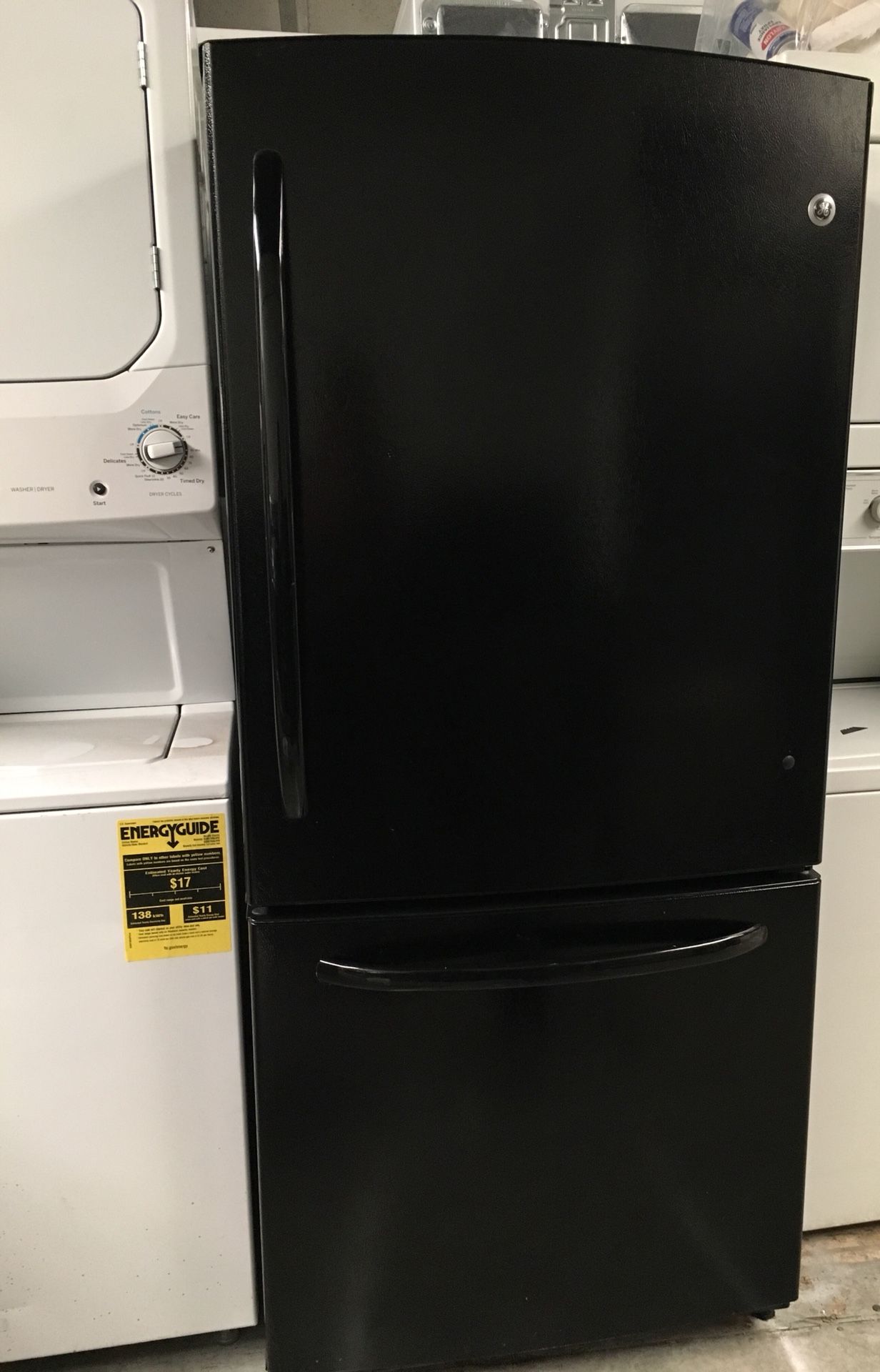 Black refrigerator GE bottom Freezer 33”wide x 66inch height.