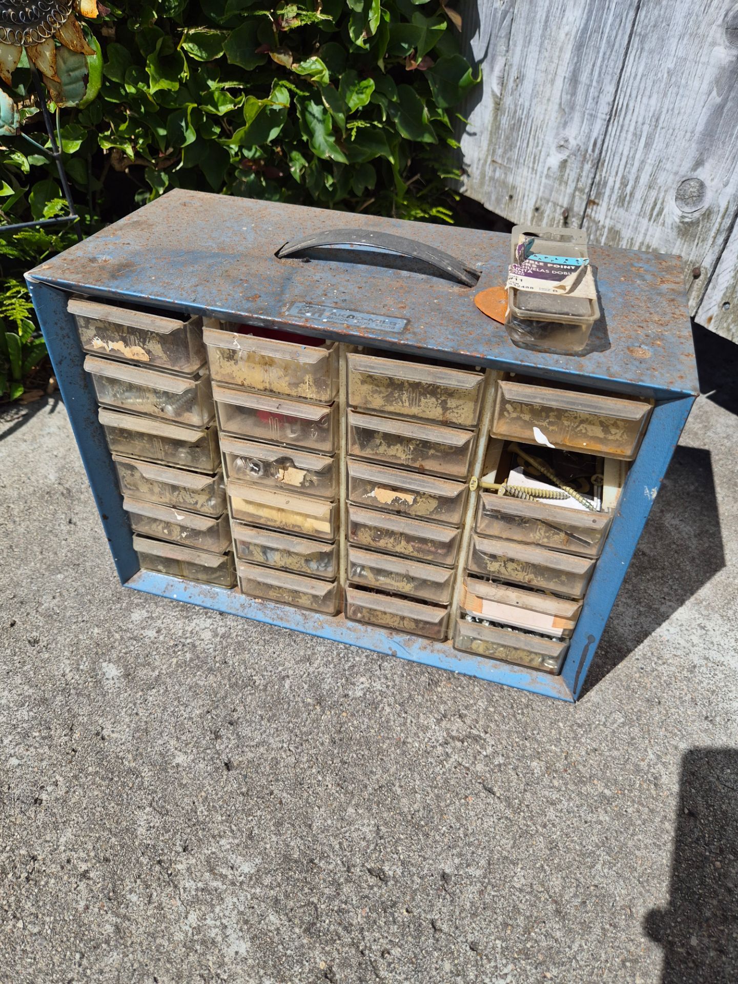 vintage Akro-Mils blue metal storage cabinet with clear plastic drawers
