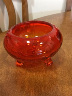 Transparent orange footed antique bowl