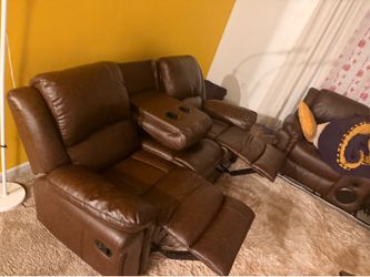 Brown leather two piece sofa for sale . Sofa also has blue lights around it with remote control $1000