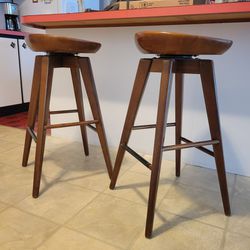 Pair of Swivel Wooden Contoured Stools