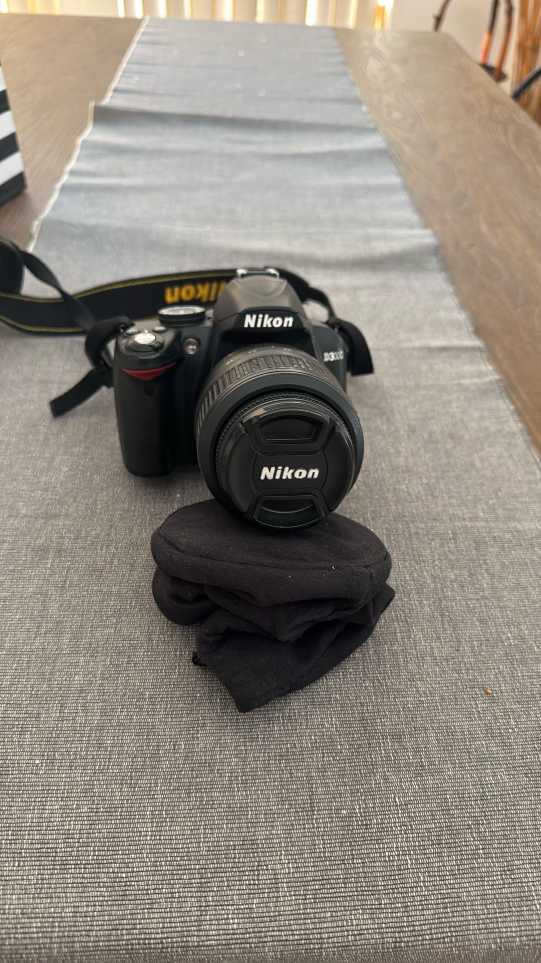 Nikon D3000 DSLR camera, which is an entry-level model.