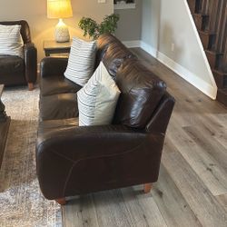 Used  2 Leather Couches. Entry Bench. 2 Solid Wood Painted End Tables Coffee Table