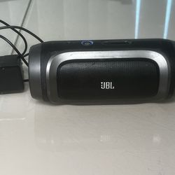 JBL Charge 1st Generation Portable Bluetooth Speaker Tested  With Charger Works. Used in good condition with some cosmetic blemishes. These blemishes 