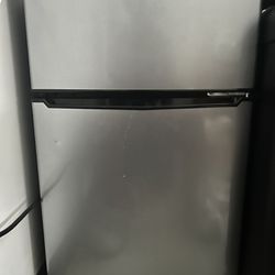Grey fridge with freezer 
