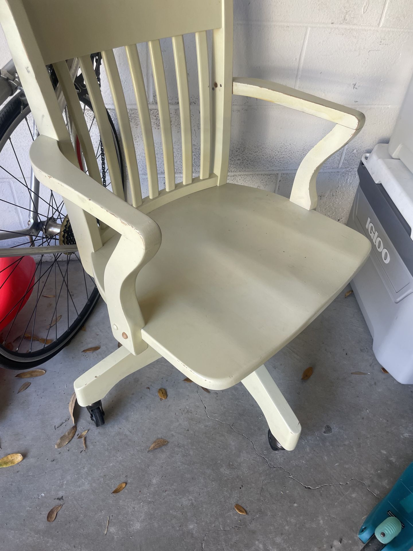 Beautiful cream wooden chair on wheels