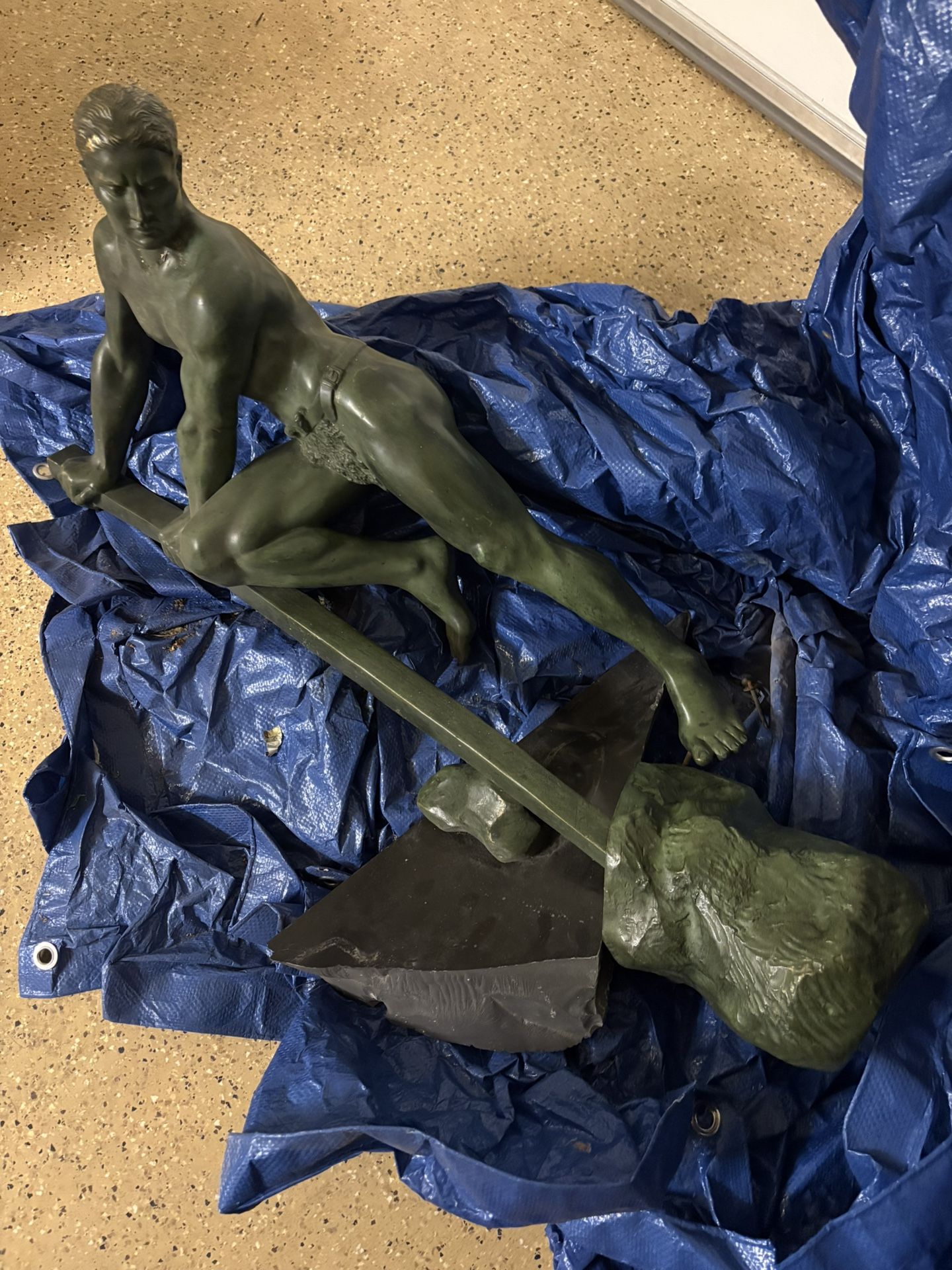 Man Lifting A Rock -Bronze Sculpture With Green Patina