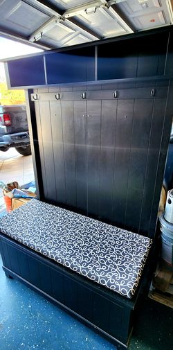 In good condition.. for coats or purses, books, and storage area under the bench seat 64H x 42W