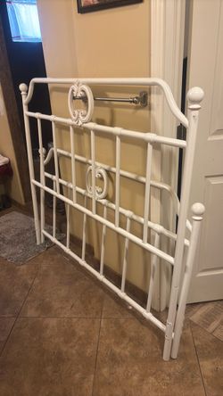 Ornate white full sized headboard and footboard