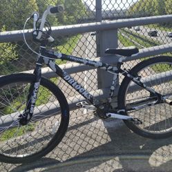 Dblock Camo White and black SE bike.