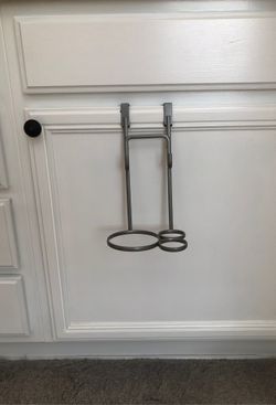 Over the door hairdryer/brush holder