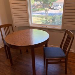 small round table and chairs. Couple of knicks. In good shape