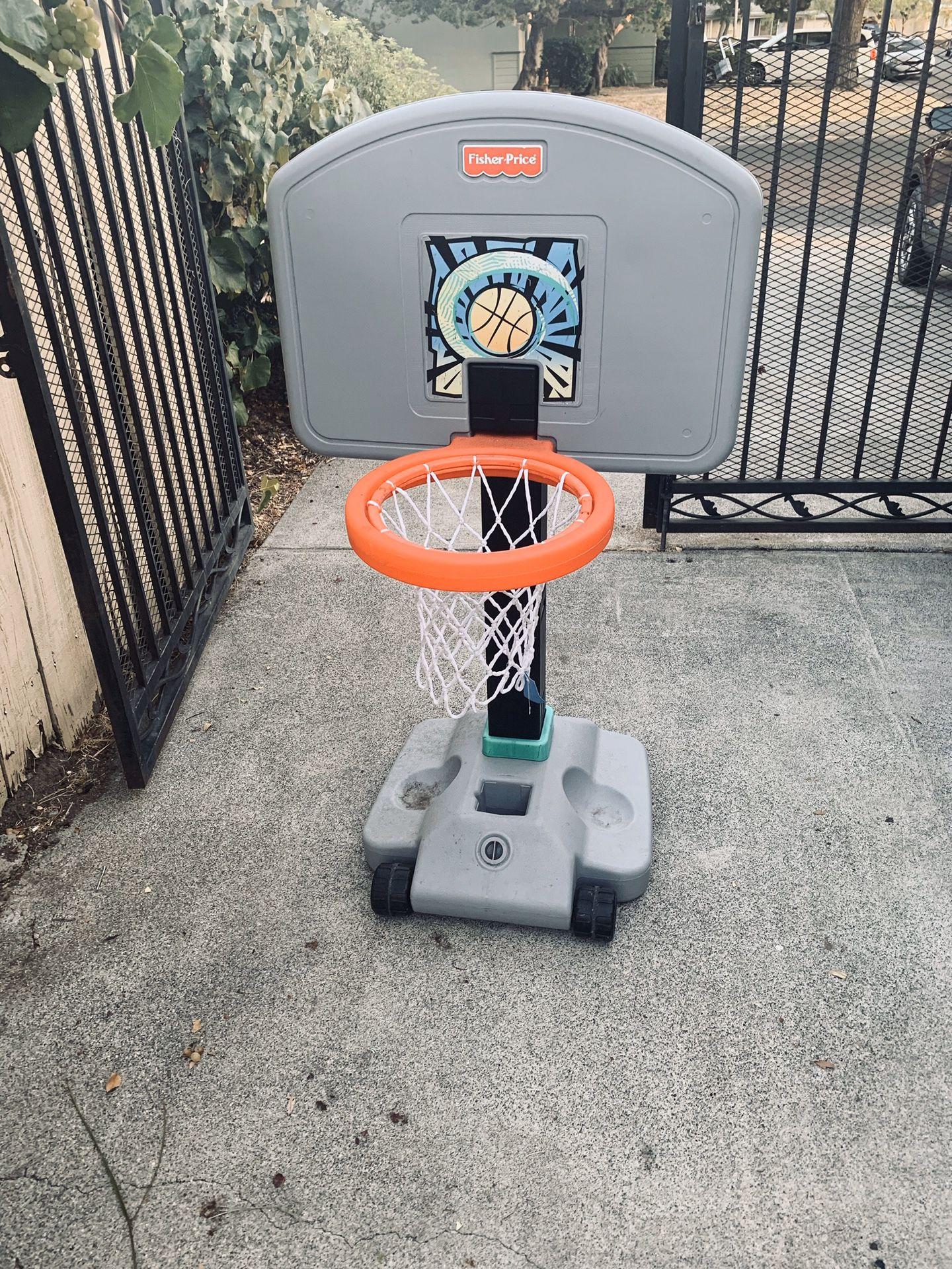 Fisher price child’s basketball hoop with wheels