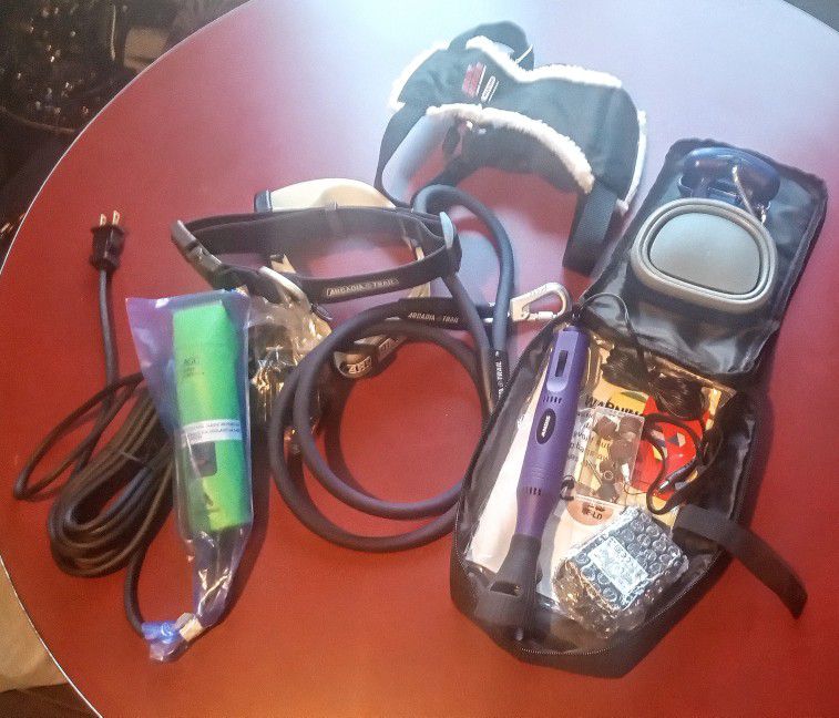 Brand New Dog Supplies, Hair Trimmer, Nail Grinder/Trimmer, Collar's, Leash, Car Harness, And Portable Poop Scooper.  All New!! 